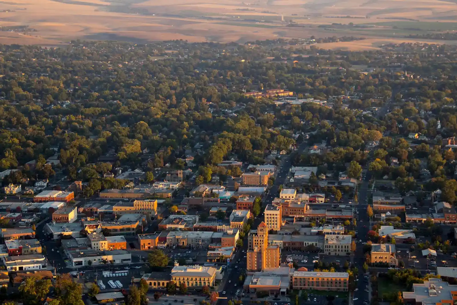 Downtown Walla Walla from the air at golden hour with Main Street visible